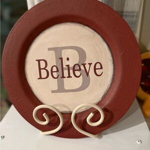 Red and Cream Decorative Plate with 'Believe' Text